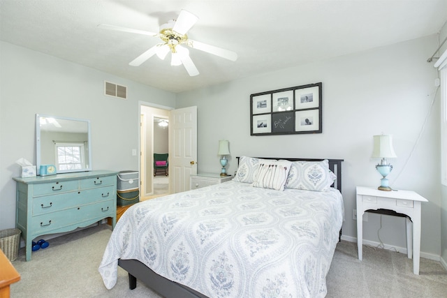 bedroom with visible vents, baseboards, ceiling fan, and carpet floors