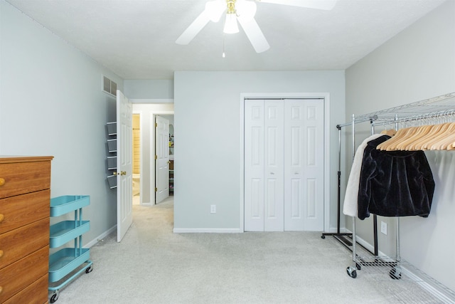 interior space with a closet, visible vents, baseboards, and a ceiling fan