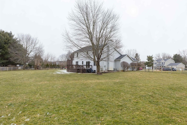 view of yard with a wooden deck and fence