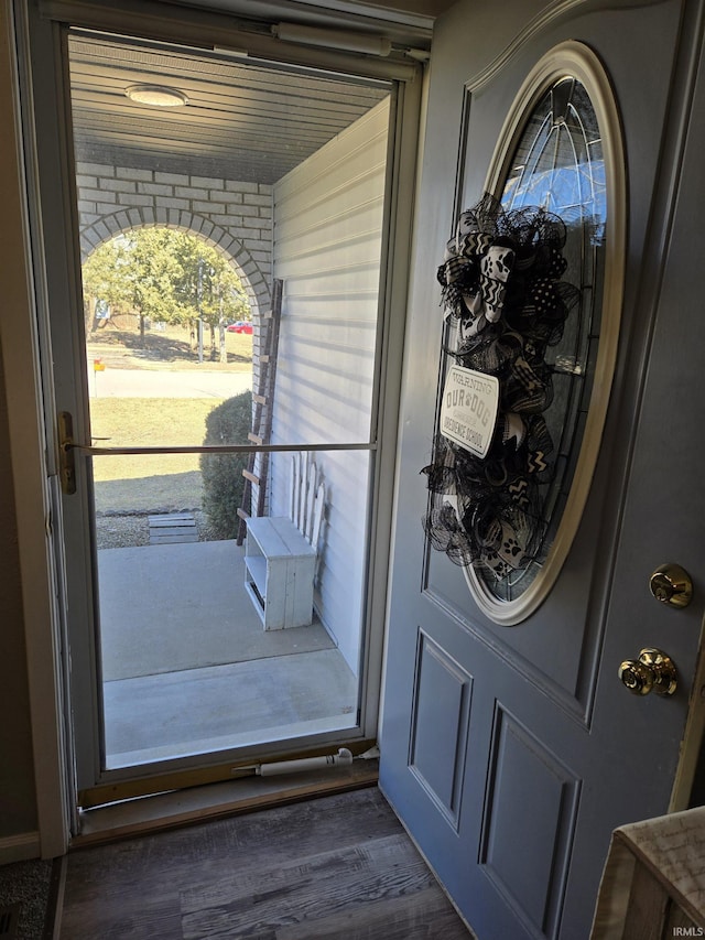 doorway to property featuring covered porch