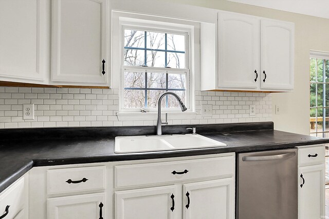 904 S Deer Run, Ellettsville, IN 47429 - kitchen featuring a sink, tasteful backsplash, stainless steel dishwasher, dark countertops, and white cabinetry