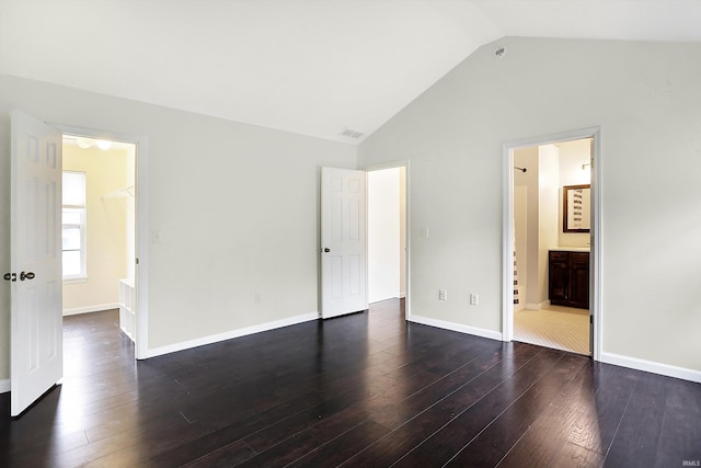 904 S Deer Run, Ellettsville, IN 47429 - unfurnished bedroom featuring vaulted ceiling, dark wood-style floors, and baseboards