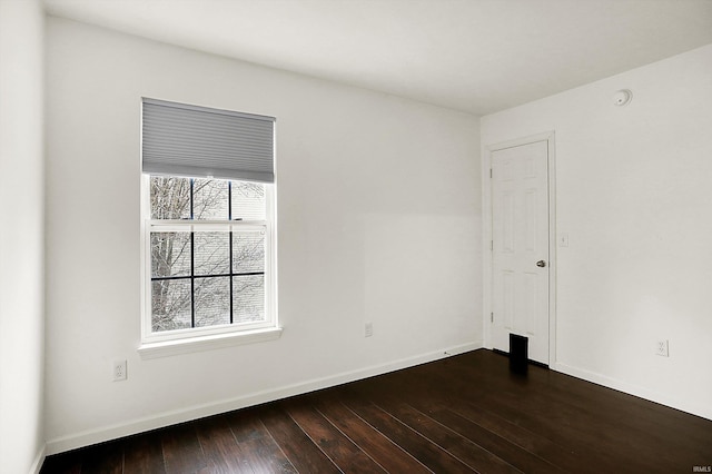 904 S Deer Run, Ellettsville, IN 47429 - spare room featuring dark wood-type flooring and baseboards