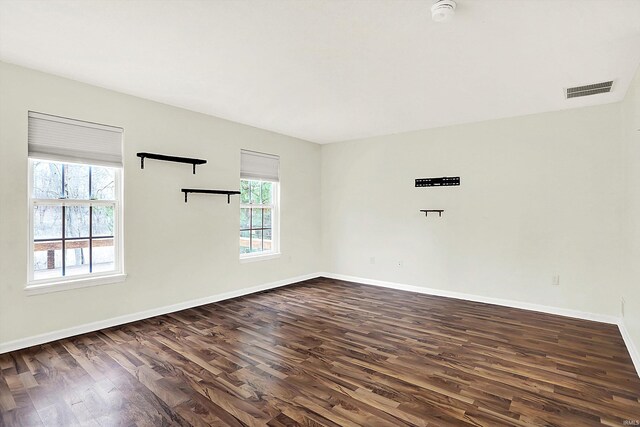 904 S Deer Run, Ellettsville, IN 47429 - spare room with dark wood finished floors, visible vents, and baseboards