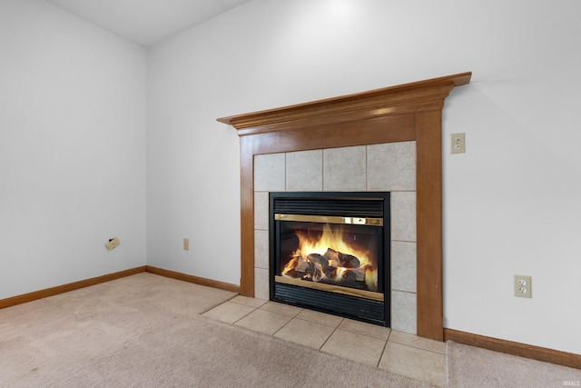 interior details with baseboards, carpet, and a fireplace