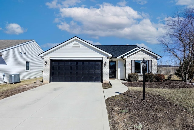 ranch-style home with brick siding, cooling unit, driveway, and an attached garage