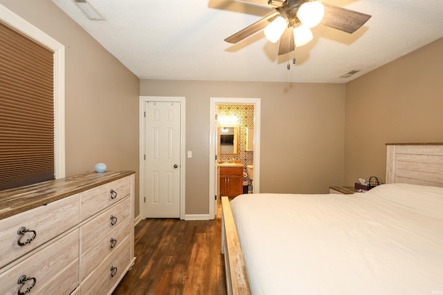 bedroom with ceiling fan, visible vents, baseboards, and dark wood-style floors