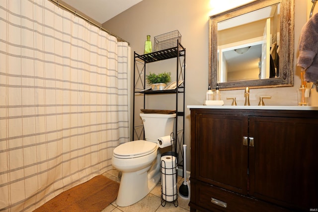 bathroom with vanity, toilet, a shower with curtain, and tile patterned flooring