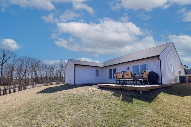 back of house with a deck, central AC unit, a yard, and fence