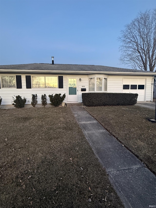 single story home with a garage