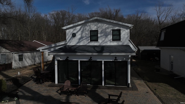 back of house with a patio