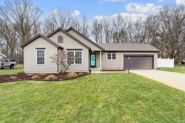 ranch-style house featuring a front yard, concrete driveway, fence, and a garage