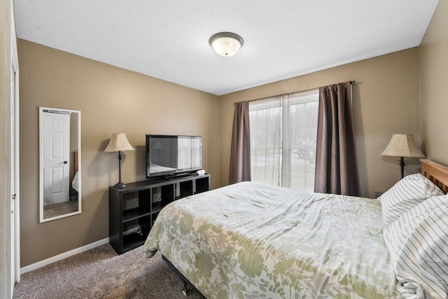 carpeted bedroom with baseboards