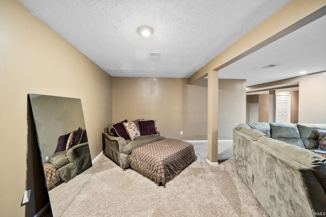 living area featuring visible vents, carpet floors, a textured ceiling, and baseboards