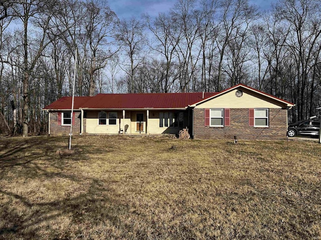 single story home with brick siding and a front lawn