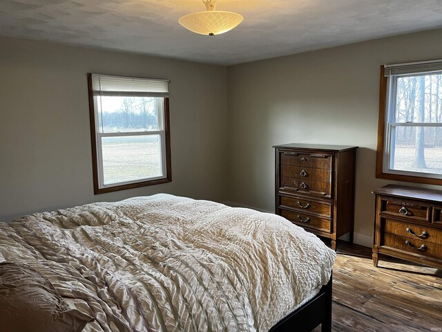 bedroom featuring wood finished floors