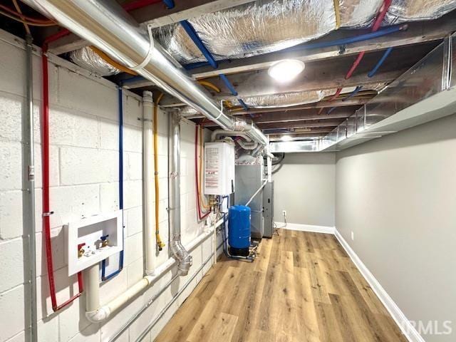 utility room with tankless water heater