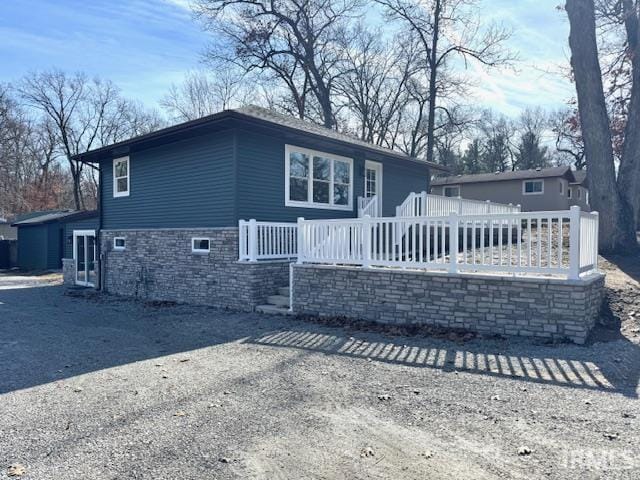 view of front of house with stone siding