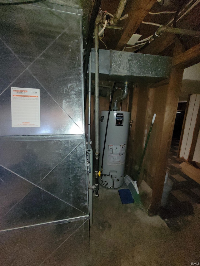 utility room with heating unit and gas water heater