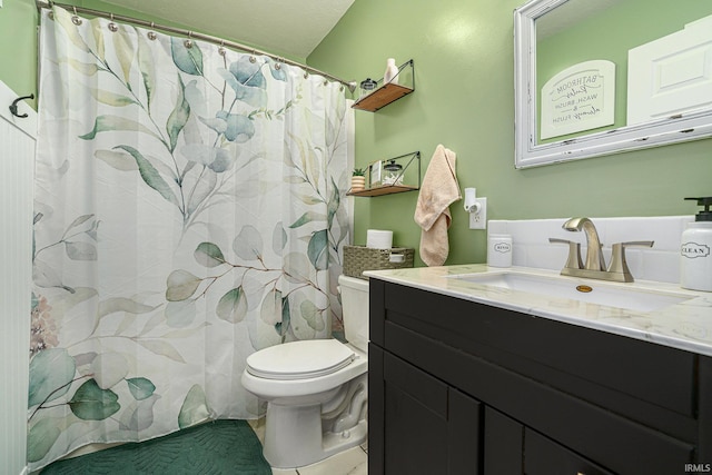 bathroom featuring toilet, vanity, and a shower with curtain