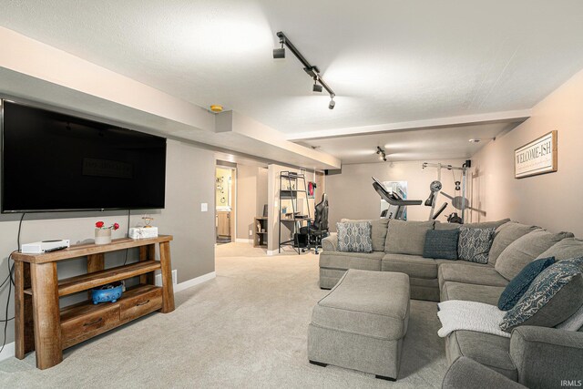 living area featuring baseboards, light colored carpet, and rail lighting