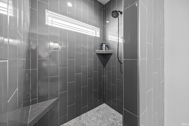 bathroom featuring tiled shower