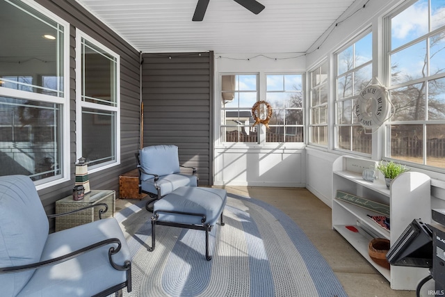 sunroom / solarium featuring a healthy amount of sunlight and ceiling fan