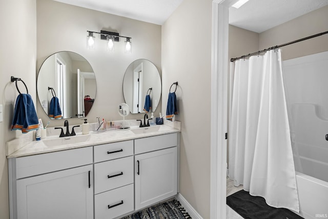 full bath with double vanity, shower / bathtub combination with curtain, and a sink