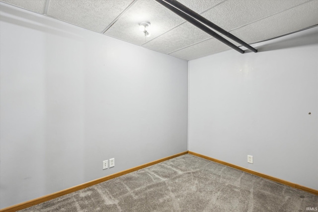 carpeted spare room with baseboards