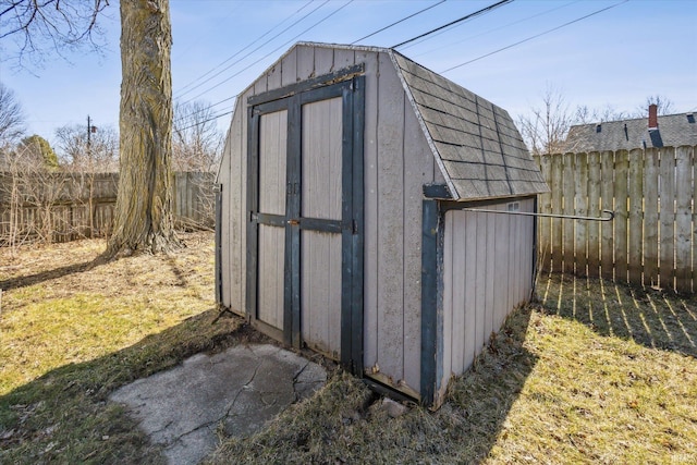 view of shed featuring a fenced backyard