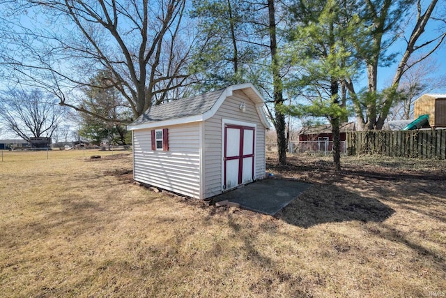 view of shed with fence