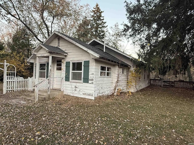 back of house featuring fence