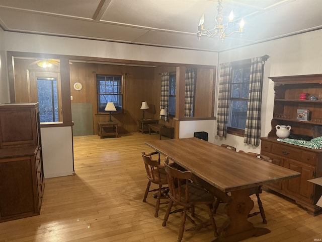 dining room with a notable chandelier and wood-type flooring