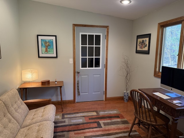 office area featuring baseboards and wood finished floors