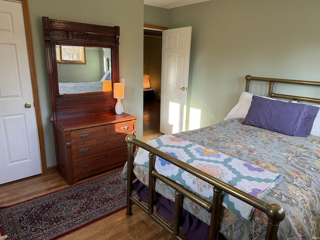 bedroom featuring wood finished floors