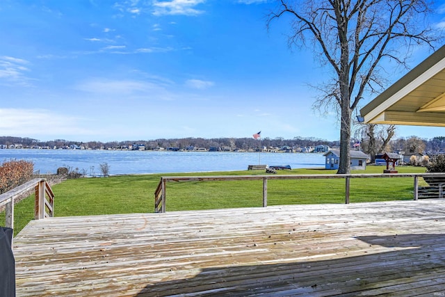 deck featuring a yard and a water view