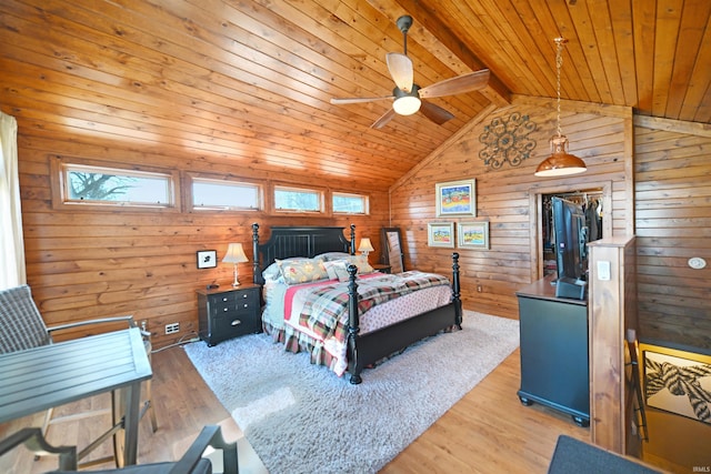 bedroom with vaulted ceiling with beams, wood walls, wood ceiling, light wood-style floors, and a closet