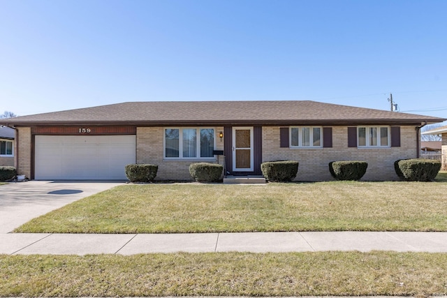 single story home with concrete driveway, an attached garage, brick siding, and a front lawn