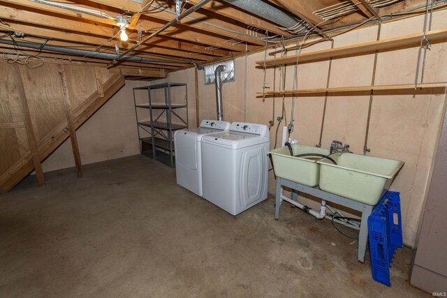 unfinished below grade area with independent washer and dryer and a sink