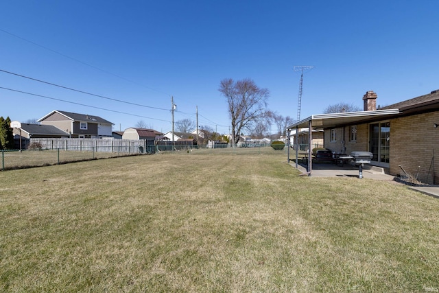 view of yard featuring a patio and fence