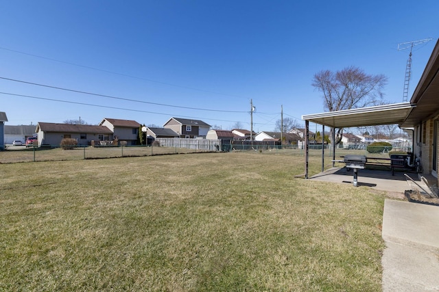 view of yard with a patio area, a residential view, and fence