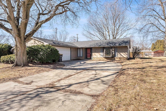 view of front facade featuring brick siding, an attached garage, and concrete driveway