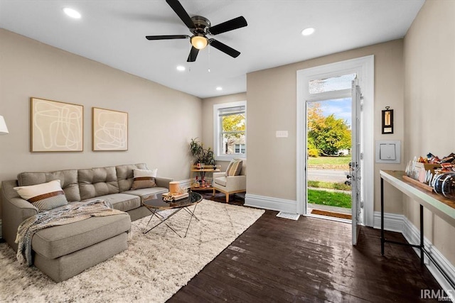 living room featuring recessed lighting, dark wood-type flooring, baseboards, and ceiling fan