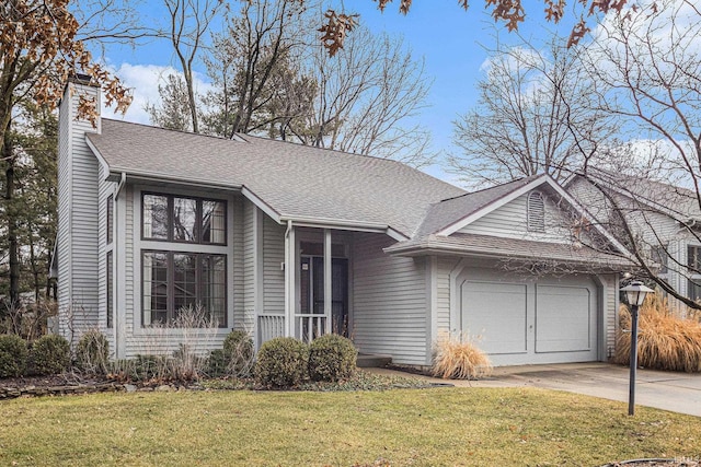 view of front of property with driveway, a front yard, a shingled roof, a garage, and a chimney