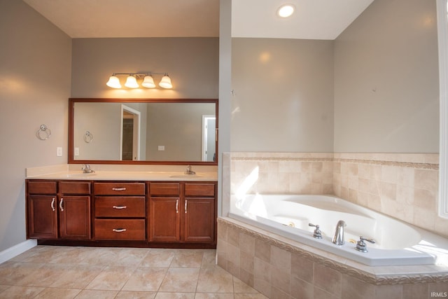 full bathroom with double vanity, tile patterned floors, a garden tub, and a sink