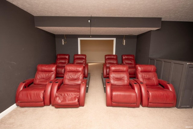 cinema featuring a wainscoted wall, a textured ceiling, and carpet