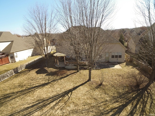 rear view of property with a fenced backyard