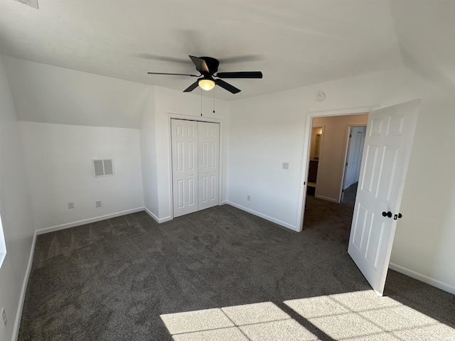 unfurnished bedroom with visible vents, baseboards, and dark colored carpet