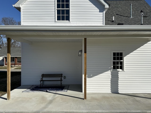 view of exterior entry with a patio area