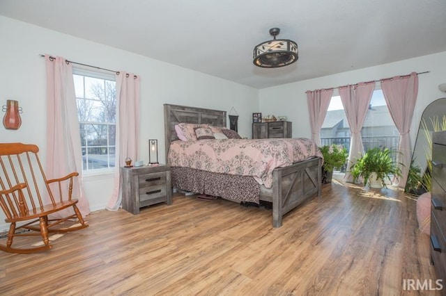 bedroom with light wood-type flooring